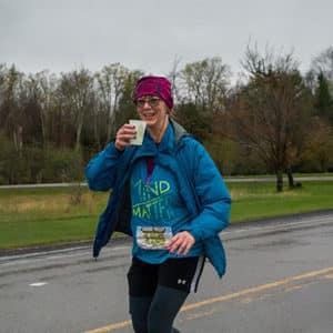 Runner grabbing water Canaan Valley Half Marathon